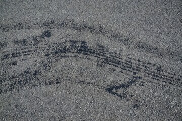 Obraz premium Asphalt Skies: Echoes of Tires on Gravelly Roads in Quiet Solitude