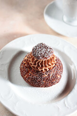 Pastry with custard. French pie Shu with peach jam. Modern dessert.