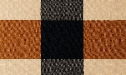 Fototapeta premium Textured fabric with a modern plaid pattern in earthy tones on a neutral background.