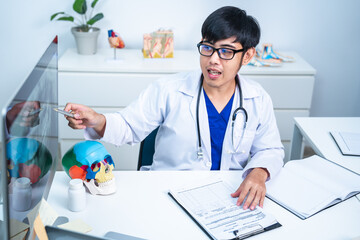 Dentist explaining tooth X-Rays to patient or consultation and recommend guidelines for orthodontics Dentist giving advice on patient's condition. A doctor is diagnose for mouth injury or pain result