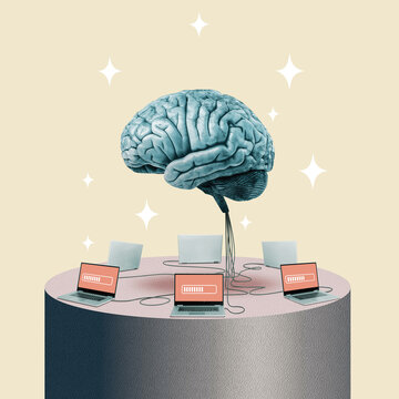 The big brain is connected to a group of laptops.