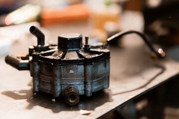 Detailed Close-Up of a Mechanical Fuel Pressure Regulator on a Workbench