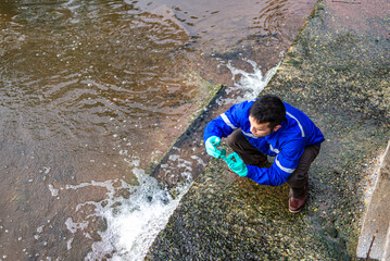 top view of Water resources engineers check the purity of water flowing through pipes from natural...