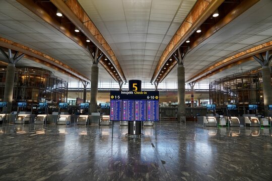 Information sign displaying flight information at Oslo airport Gardermoen