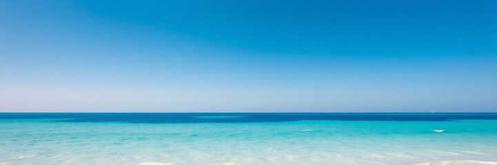 Fototapeta premium A serene ocean background with crystal clear blue waters, gently lapping against a sandy beach under a clear blue sky, ocean, peaceful