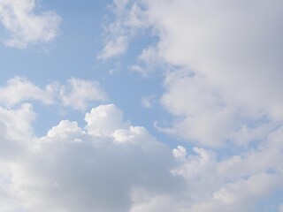 Fototapeta premium A serene landscape with fluffy white clouds covering a clear blue sky, outdoors, soft
