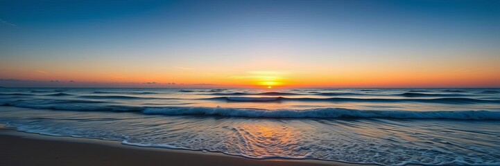 Fototapeta premium A serene image of the vast ocean horizon during sunset, with gentle waves crashing against the shore, horizon, waves