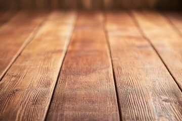 Close-up of rustic wooden planks on the floor with a warm brown color.