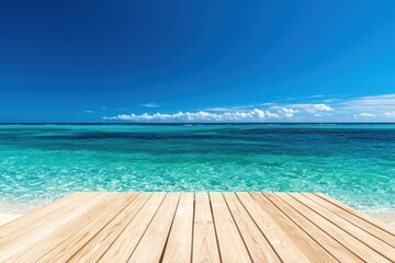 Fototapeta premium Scenic view of a wooden deck overlooking a tranquil ocean and clear blue sky.
