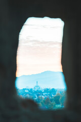 The sun sets behind the mountain. View of a Ukrainian village
