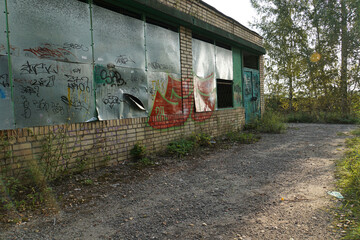 Broken and abandoned store building in the rural town.