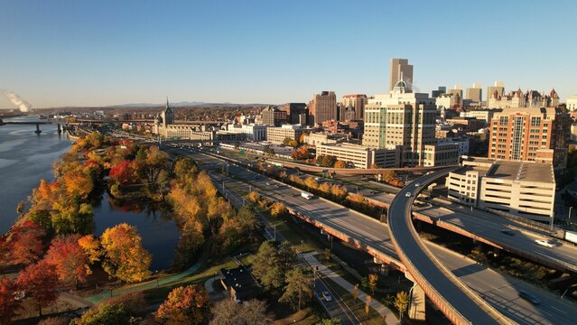 Aerial view of Albany, New York showcasing fall foliage along the Hudson River