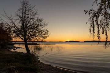 Golden sunset over Lake Sniardwy. Landscape of Masuria in Poland.