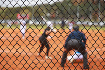 fastpitch softball players in action