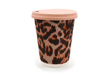 Disposable glass for drinks to go made of organic material isolated on white background. Fashionable tiger or leopard print. Disposable tableware for coffee drinks and tea.