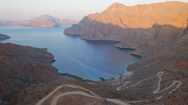 panoramic view of the Musandam fjords from a rocky cliff at sunset, Khor Najd, Oman