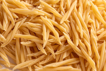 Sfondo di trofie crude, tipico formato di pasta italiano 