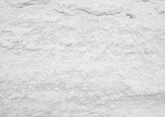 Light grey rough stone wall for abstract background and texture for interior or exterior design. Beautiful patterns, space for work, banner, wallpaper close up.