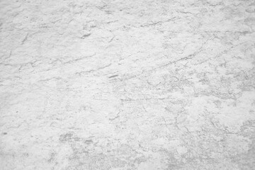 Light grey bumpy stone wall for abstract background and texture for interior or exterior design. Beautiful patterns, space for work, banner, wallpaper close up.