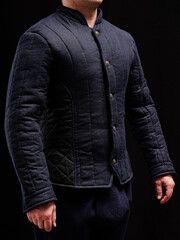 Historical fashion. Medieval knight cloth. Padded jacket gambeson.