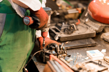 Mechanic Assembling a Machinery Component in a Workshop