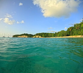 anse canot in evening light seen from the sea with copy space, beach in Saint Louis, Marie Galante, Guadeloupe