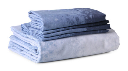 Stack of clean bed linen isolated on white