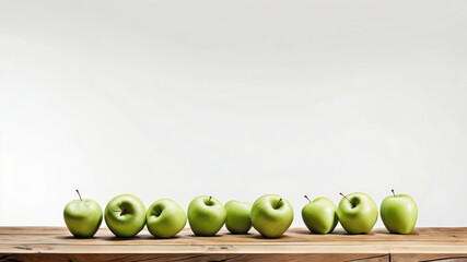 Apples on a wooden shelf. The fruits are green - ripe and juicy. The background is a white wall. Vertical illustration with space for text.