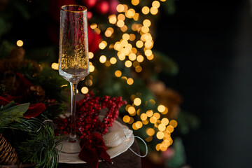 Festive New Year's Eve Setting with Champagne Flute and Christmas Decorations