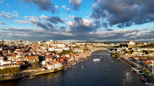 Aerial 4K drone video footage of Dom Luis I Bridge over Douro river and panoramic Porto view. Portugal city landscape