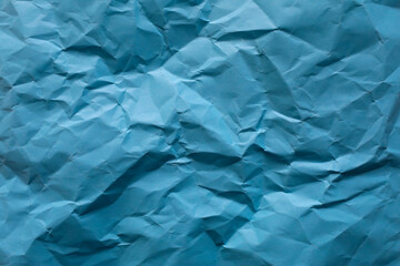 Crumpled blue paper as background