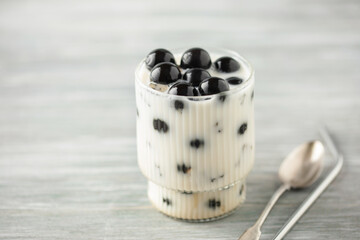 Tea jelly with milk in glass. Dessert after dinner