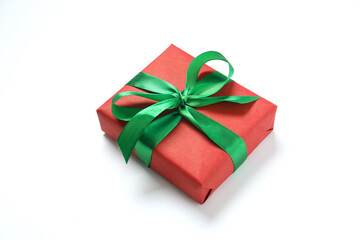 Beautiful gift box tied with bow on color background 