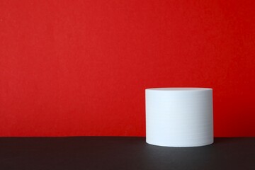 White podium on two tone background