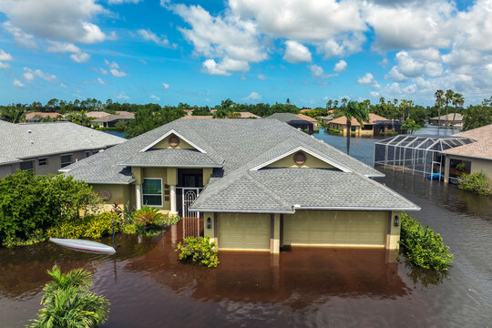 Flooding in Florida caused by tropical storm from hurricane Debby. Suburb houses in Laurel Meadows residential community surrounded by flood waters in Sarasota. Aftermath of natural disaster