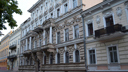 Ornate historic building facade with intricate details and arched windows, capturing the elegance of classic European architecture.