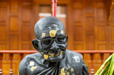 Fototapeta premium Details from statues of Buddha and monks in a temple in Bangkok