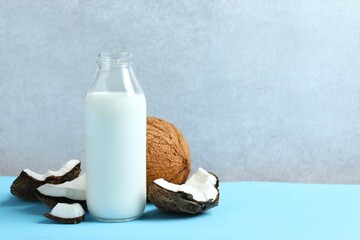 Bottle of milk with coconuts on the table