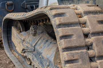 Rubber track on skid steer loader. Construction and earthmoving equipment maintenance, service, and repair