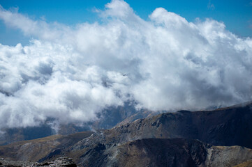 Cloudy over mountains on hiking trail to Mulhacen peak, Sierra Nevada National park, Andalusia, Spain