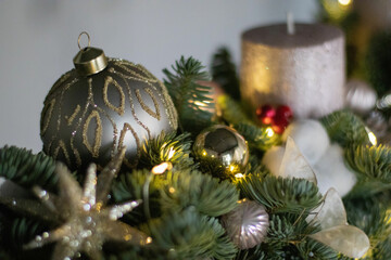 Christmas floral composition of fresh Nobilis. Cotton flowers spruce, sparkling ornaments. Holiday concept. Happy New Year decorations. Ideal decoration article for office and home tables.