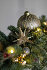 Christmas floral composition of fresh Nobilis. Cotton flowers spruce, sparkling ornaments. Holiday concept. Happy New Year decorations. Ideal decoration article for office and home tables.