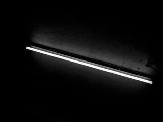 Ceiling Neon Light in Moody Atmosphere – Black and White Contrast
