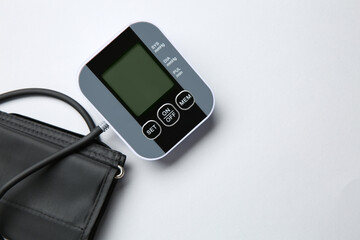 Blood pressure measuring device on white background, top view. Space for text