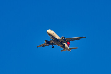 A passenger plane takes off into the sky