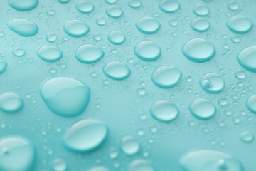 Water drops on turquoise background, closeup view