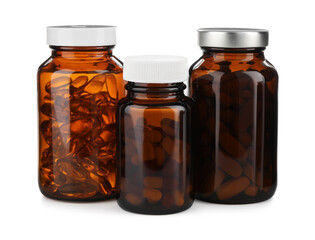 Medical bottles with pills isolated on white