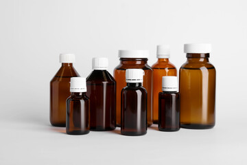 Medical bottles with medicine on white background