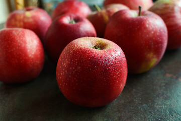 Fresh wet red apples on dark background