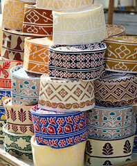  traditional Muslim headwear on a market on zanzibar